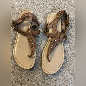 Brown sandals with gold detailing